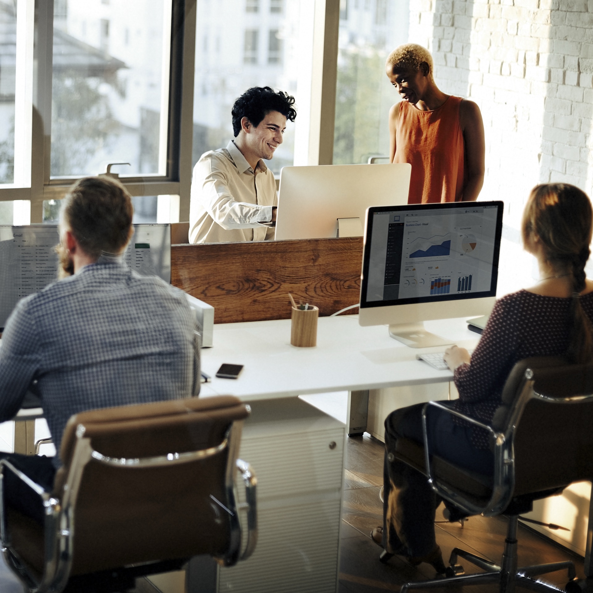 Financial consultants meeting with a client team