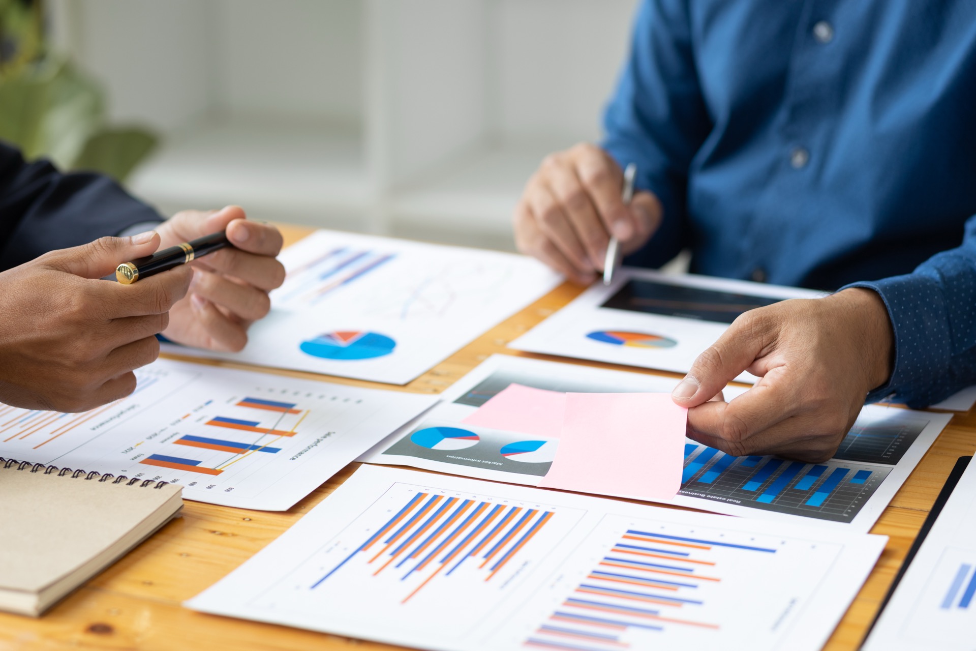 Consultants reviewing supplier risk data