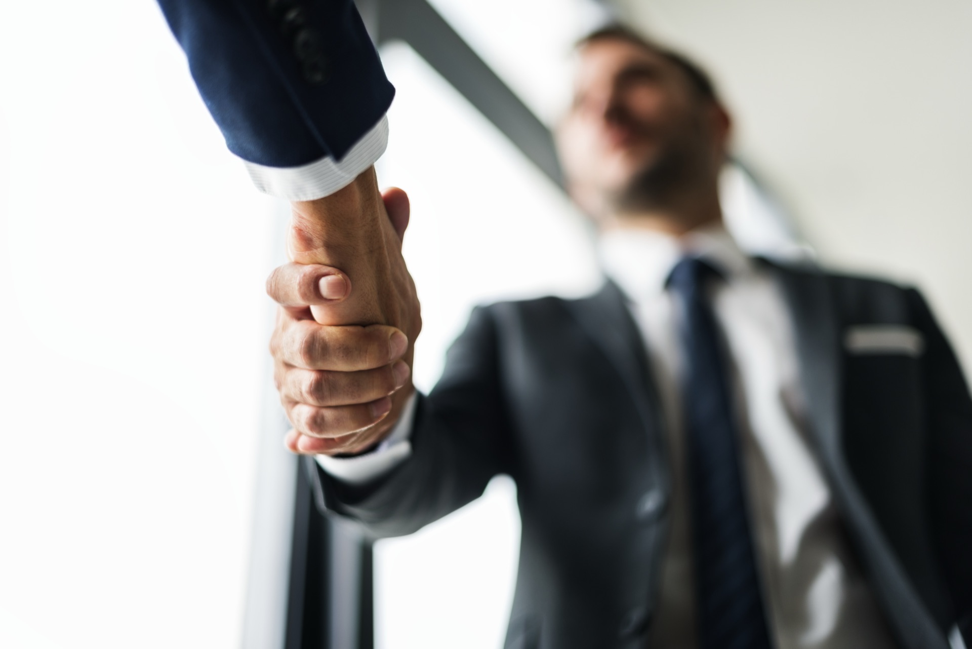 Business handshake sealing a transaction
